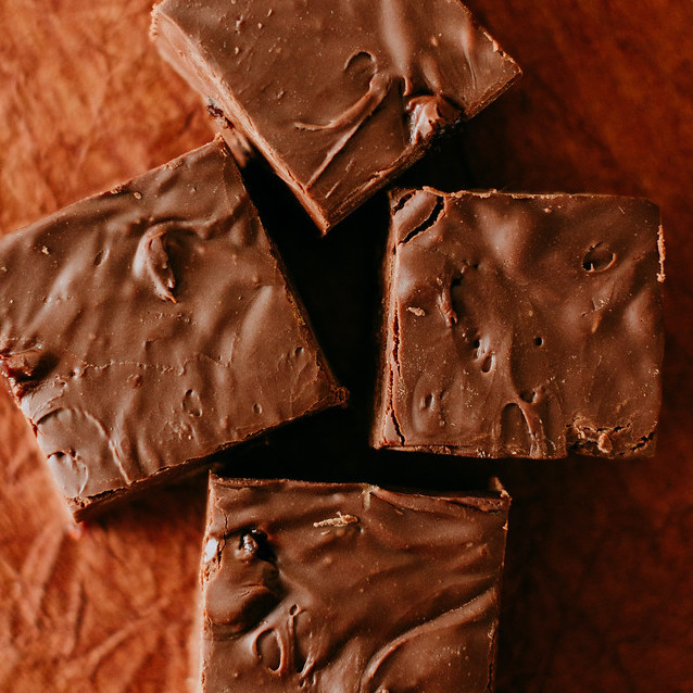 square version of chocolate cherry fudge squares next to eachother
