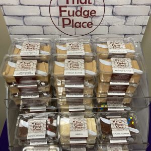 that fudge place display with piles of different flavors of fudge in clams